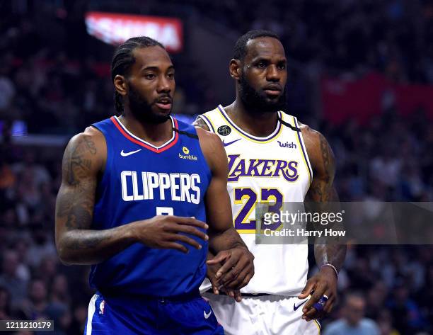 Kawhi Leonard of the LA Clipper and LeBron James of the Los Angeles Lakers during the first half at Staples Center on March 08, 2020 in Los Angeles,...