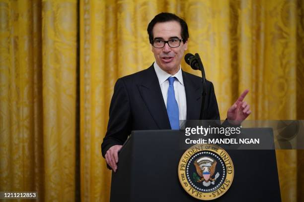 Secretary of the Treasury Steve Mnuchin, speaks in the East Room of the White House in Washington, DC, on April 28, 2020. - Trump spoke about...