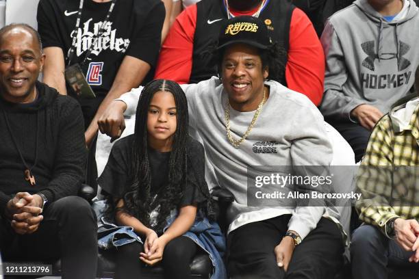 Jay-Z and Blue Ivy Carter attend a basketball game between the Los Angeles Clippers and the Los Angeles Lakers at Staples Center on March 08, 2020 in...