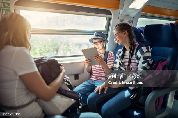 family travelling by train in cinque terre, italy - vacation train stock pictures, royalty-free photos & images
