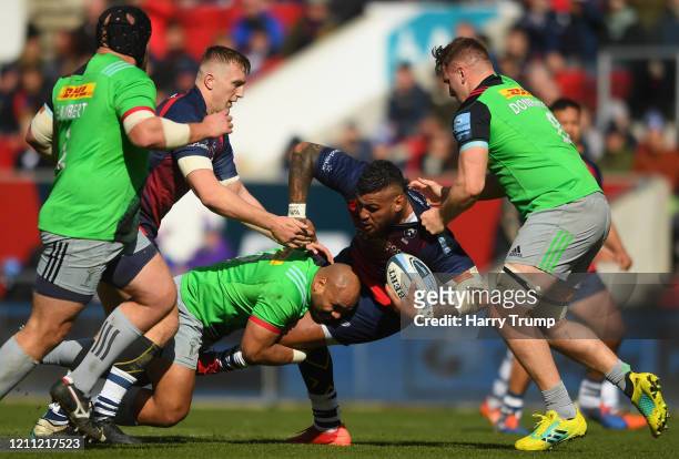 Nathan Hughes of Bristol Bears is tackled by Paul Lasike of Harlequins during the Gallagher Premiership Rugby match between Bristol Bears and...