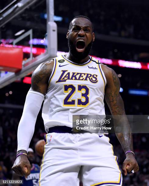 LeBron James of the Los Angeles Lakers celebrate his basket and LA Clippers foul during a 112-103 Lakers win at Staples Center on March 08, 2020 in...