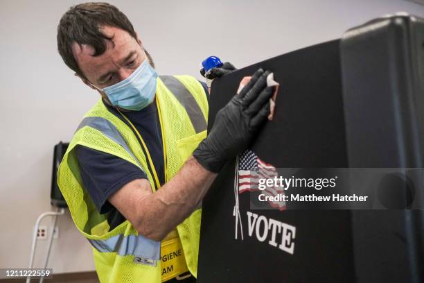 Staff of the Franklin County Board of Elections take measures to sanitize voting stations and provisional ballot envelop stations so that Ohio...