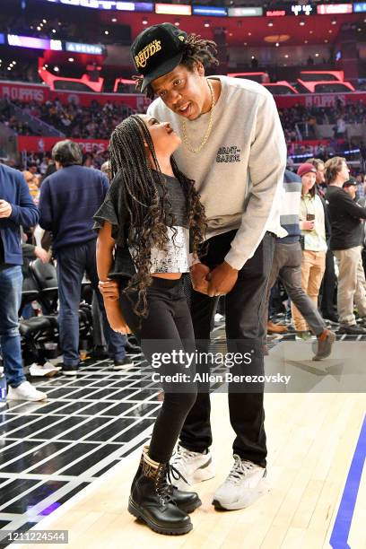 Jay-Z and Blue Ivy Carter attend a basketball game between the Los Angeles Clippers and the Los Angeles Lakers at Staples Center on March 08, 2020 in...