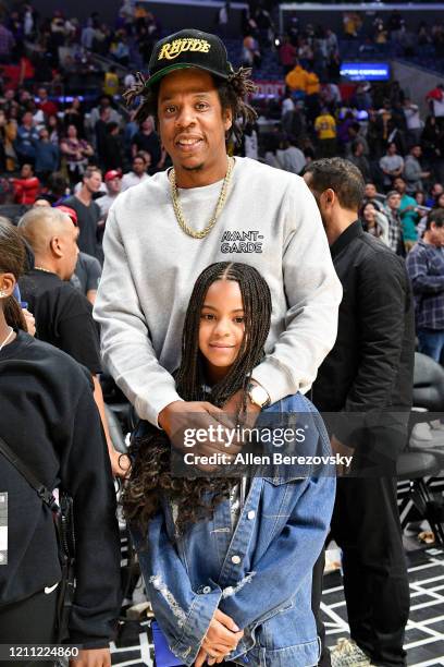 Jay-Z and Blue Ivy Carter attend a basketball game between the Los Angeles Clippers and the Los Angeles Lakers at Staples Center on March 08, 2020 in...