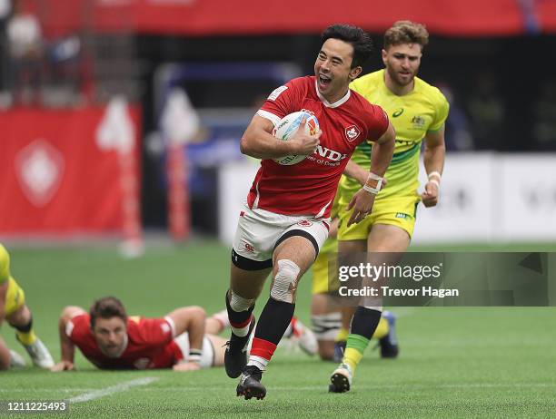 Nathan Hirayama of Canada smiles as he breaks away during their semi final rugby sevens match against Australia at BC Place on March 08, 2020 in...