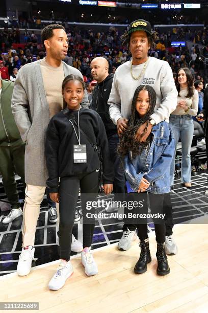 Maverick Carter, Lyra Carter, Jay-Z and Blue Ivy Carter attend a basketball game between the Los Angeles Clippers and the Los Angeles Lakers at...