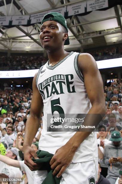 Cassius Winston of the Michigan State Spartans celebrates a 80-69 win over the Ohio State Buckeyes and a share of the 2020 Big Ten title at the...