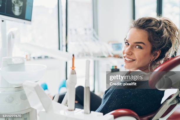 waiting in the dentist's chair - dentist's chair stock pictures, royalty-free photos & images