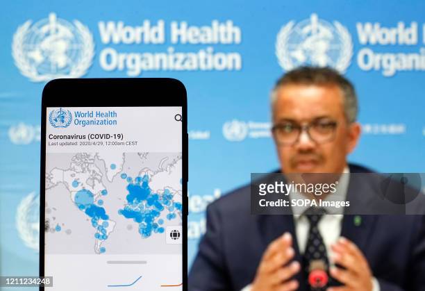 In this photo illustration the World Health Organization Director General Tedros Adhanom Ghebreyesus is seen on a screen of pc and a WHO coronavirus...