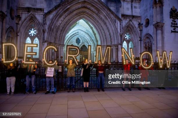 Sex workers joined by members of the public attend a decriminalisatioin Rally at The Royal Courts of Justice after an earlier march through central...