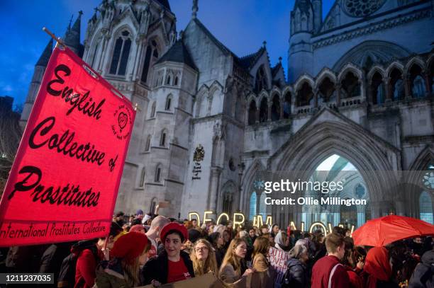Sex workers joined by members of the public attend a decriminalisatioin Rally at The Royal Courts of Justice after an earlier march through central...
