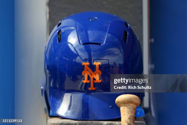 New York Mets batting helmet in the dugout before a spring training baseball game against the Houston Astros at Clover Park on March 8, 2020 in Port...