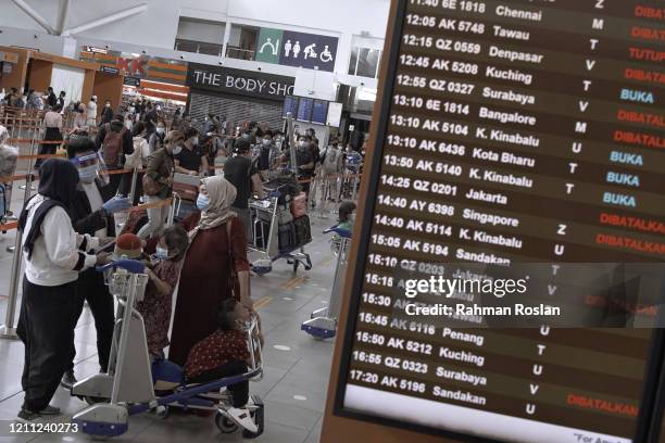 Passengers can be seen in the check in counter area manned by members of Malaysian police Force in Kuala Lumpur International Airport 2 Terminal...