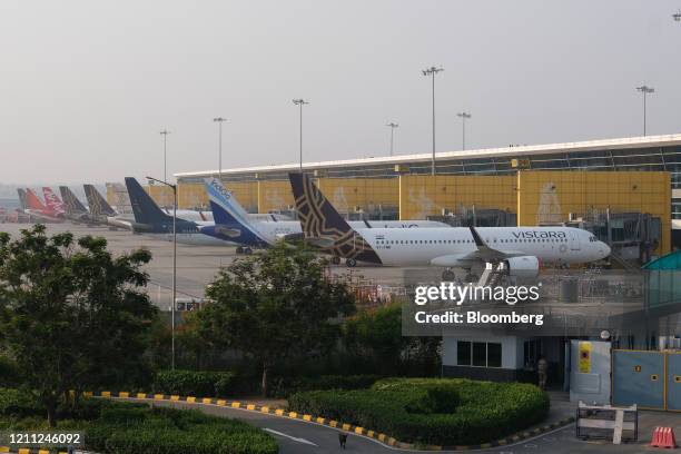 Grounded aircraft stand at Terminal 3 at the Indira Gandhi International Airport during a lockdown implemented due to the coronavirus in New Delhi,...