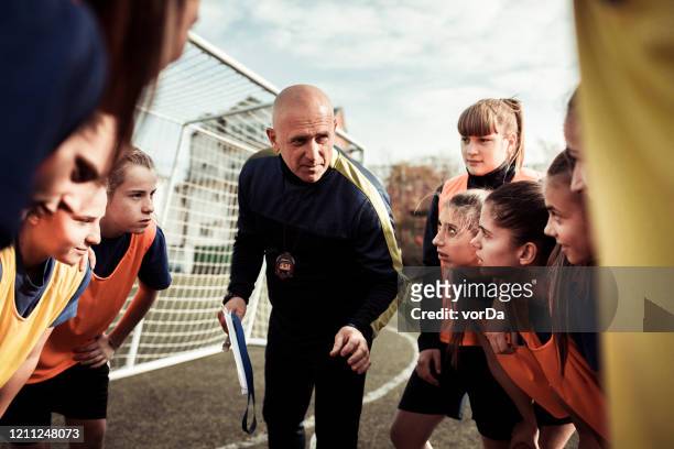 motivational speech - soccer team stock pictures, royalty-free photos & images