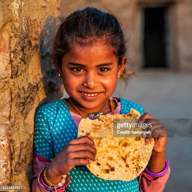Kid Eating Roti Roti Chapati Photos and Premium High Res Pictures - Getty Images