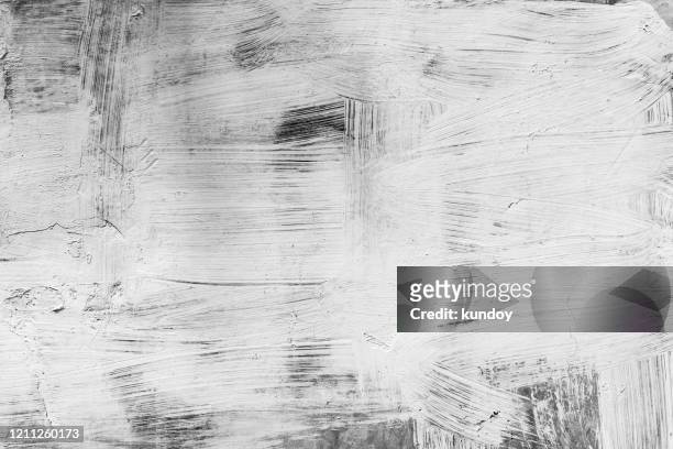 abstract art background from white color painted on black wood background. retro or vintage backdrop. - irregular texturizado imagens e fotografias de stock