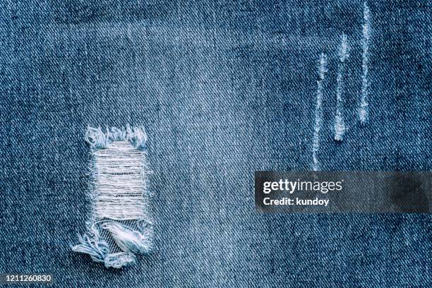 abstract background from blue denim and torn. retro and vintage. picture for add text message. backdrop for design art work. - denim photos et images de collection