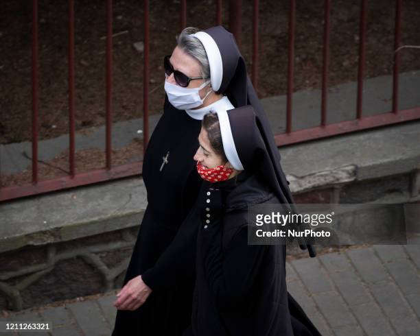 Nuns wearing facial covers ares seen in Warsaw, Poland on April 29, 2020. The Polish PM Morawiecki on Wednesday announced it will reopen schools and...
