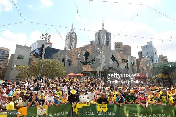 Fans show support while the Australian Women's T20 World Cup team celebrate after winning the ICC Women's T20 World Cup Final, at Federation Square...