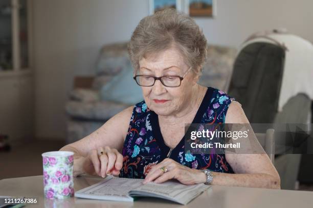Mature Woman Crossword Puzzle Photos and Premium High Res Pictures Mature Woman Crossword Puzzle Photos and Premium High Res Pictures