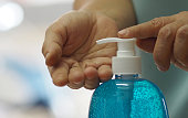 Woman push pump bottle use a hand wash gel to prevent germs protect virus covid 19