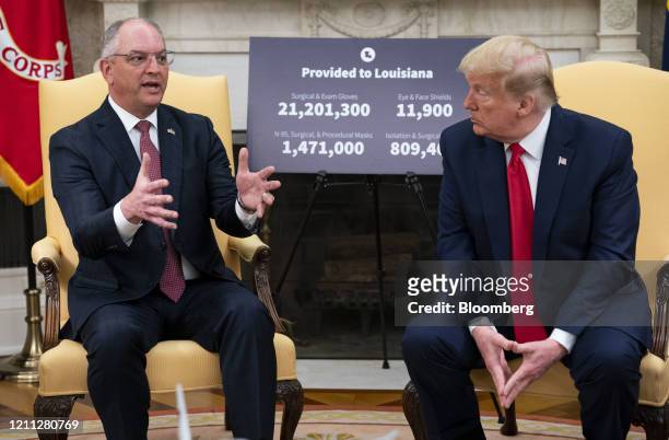 John Bel Edwards, governor of Louisiana, left, speaks as U.S. President Donald Trump listens during a meeting in Washington, D.C., U.S., on...