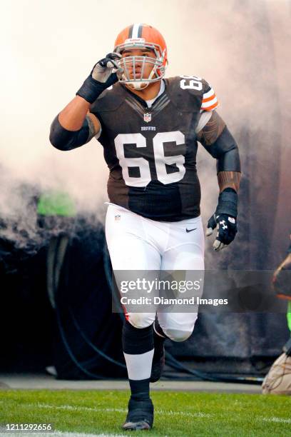 Offensive lineman Shawn Lauvao of the Cleveland Browns runs out of the tunnel during player introductions prior to a game against the Detroit Lions...