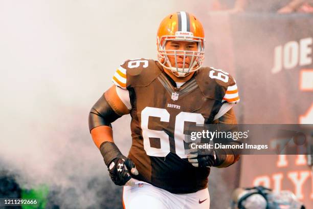 Offensive lineman Shawn Lauvao of the Cleveland Browns runs out of the tunnel during player introductions prior to a game against the Detroit Lions...