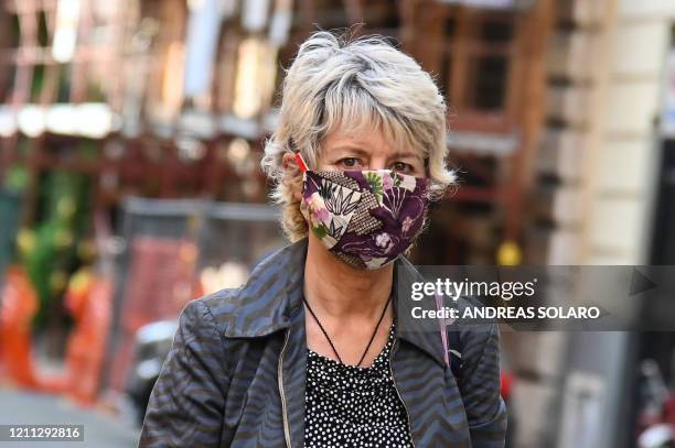 Woman wearing a homemade protective face mask looks on in Rome on April 29, 2020 during the country's lockdown aimed at stopping the spread of the...