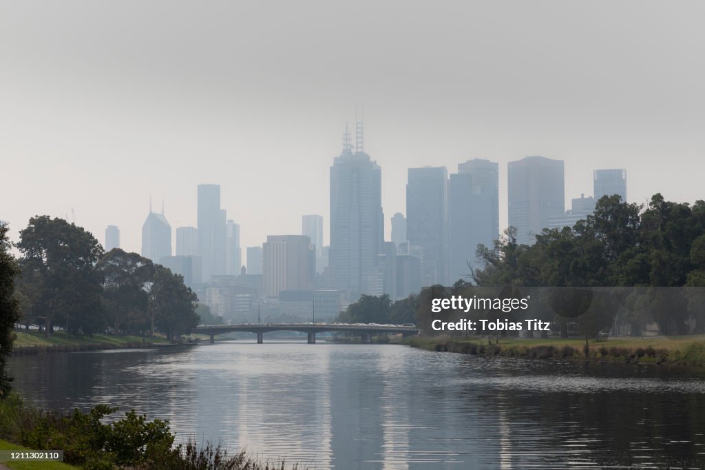 Bush fire haze over Melbourne city and Yarra River, Victoria, Australia