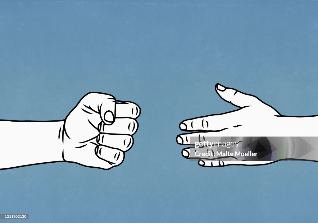 Contrasting hands open and closed in a fist