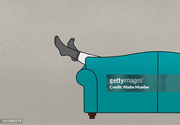 legs of man in socks dangling off sofa - feet up stock illustrations