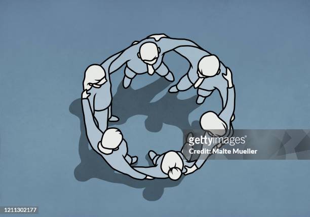 business people standing in huddle circle - gruppen im kreis stock-grafiken, -clipart, -cartoons und -symbole