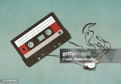 Man pulling tape from large cassette Man pulling tape from large cassette