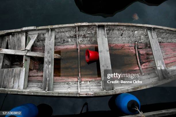 water inside rotting rowboat - rowing boat stock pictures, royalty-free photos & images