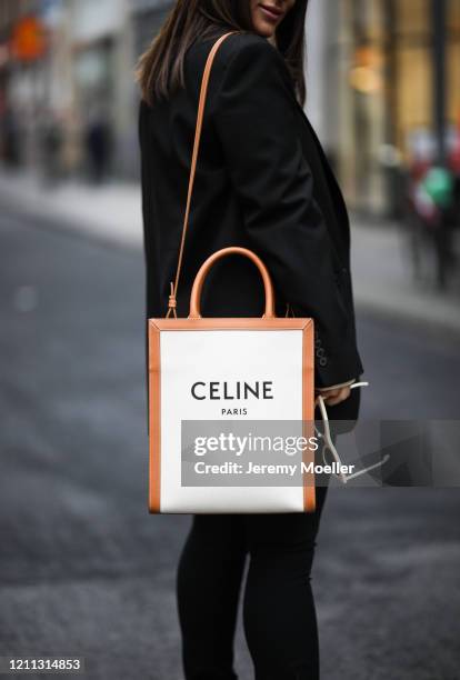 Lou Beyer wearing Celine bag, Prada boots, Cos pants, Helmut Lang shirt and Zara blazer on March 06, 2020 in Cologne, Germany.