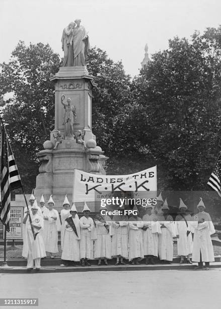 The women's auxiliary of the Ku Klux Klan of Sayville at the Peace Monument in Washington DC where they are participating in a Ku Klux Klan parade,...