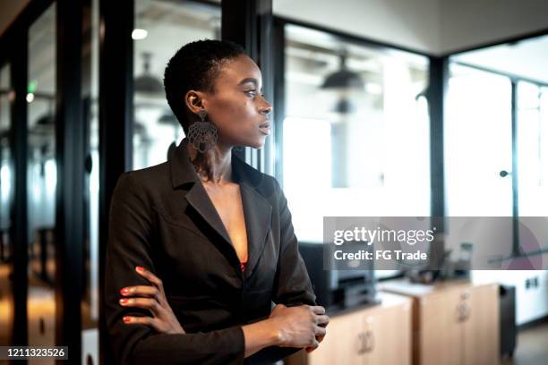 young businesswoman looking away - encouragement office stock pictures, royalty-free photos & images