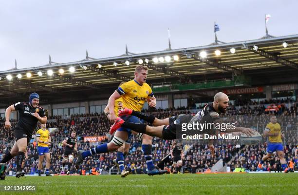 Olly Woodburn of Exeter Chiefs dives over to score his side's seventh try during the Gallagher Premiership Rugby match between Exeter Chiefs and Bath...