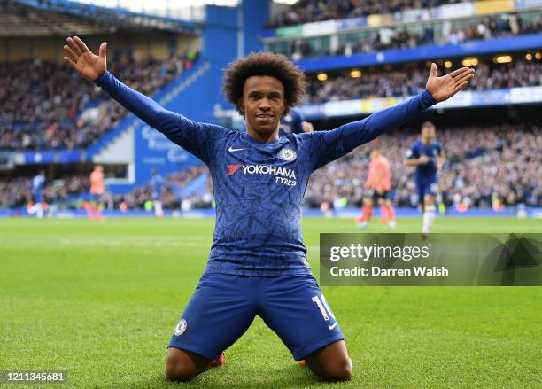 Willian of Chelsea celebrates after scoring his team's third goal during the Premier League match between Chelsea FC and Everton FC at Stamford...