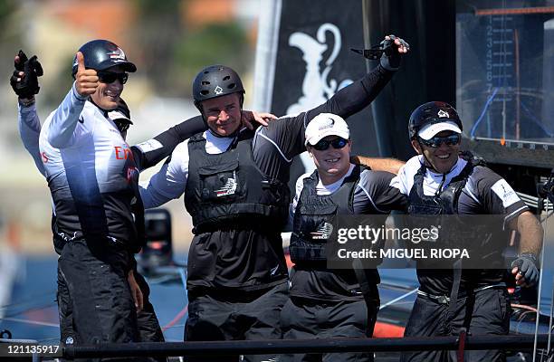Dean Barker, helmsman of Emirates Team New Zealand , poses with his crew after winning the 7th day of the America's Cup World Series Match Race...