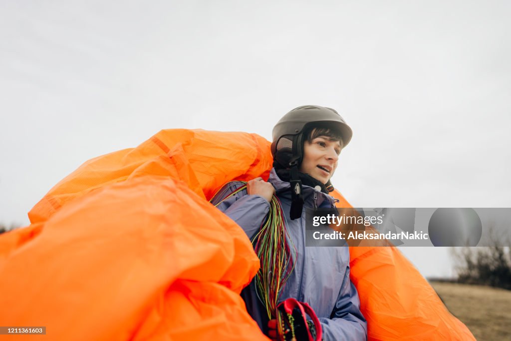 Woman carrying her parachute