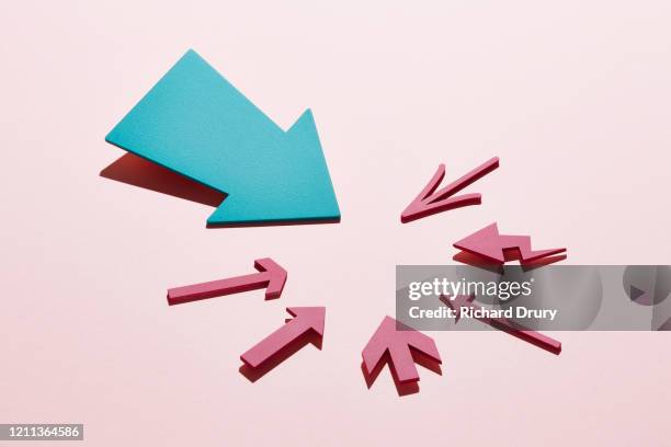 a group of arrows all pointing at the same spot - tyranny stock pictures, royalty-free photos & images