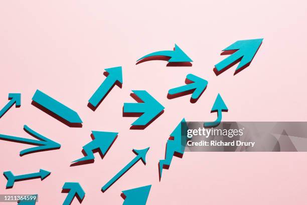 a diverse group of arrows moving up together - guidance stock pictures, royalty-free photos & images