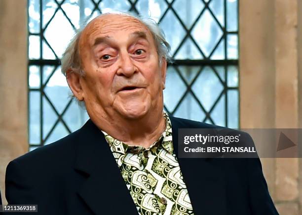 This file picture taken on January 27, 2016 shows South African social campaigner Denis Goldberg posing with an award of the Freedom of the City of...