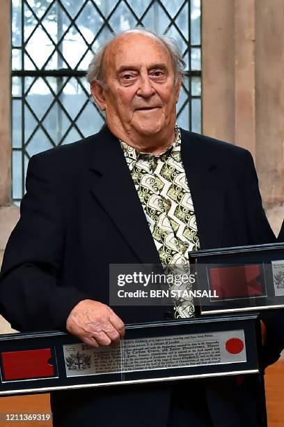 This file picture taken on January 27, 2016 shows South African social campaigner Denis Goldberg posing with an award of the Freedom of the City of...