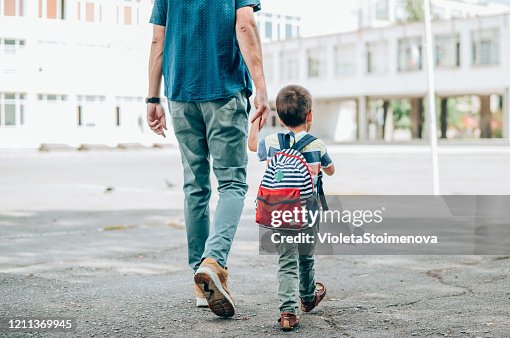 Father and son going to school. Father and son going to school.