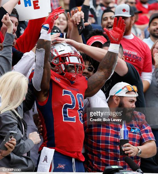 James Butler of the Houston Roughnecks celebrates a touchdown against the Seattle Dragons with the fans during a XFL football game at TDECU Stadium...